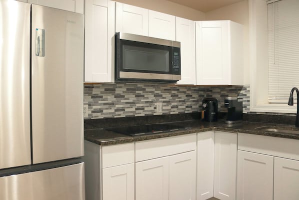 Fridge, microwave, stovetop, coffee/tea maker