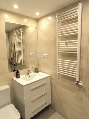 Hair dryer, towels, soap, shampoo