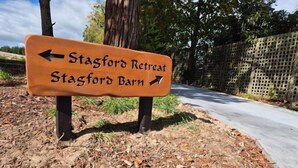A directional sign for 'Stagford Retreat' and 'Stagford Barn' with arrows pointing left and right respectively.
