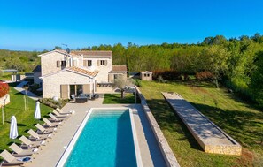 A stone villa with a swimming pool, outdoor seating, and a garden. - Amazing home in Jadruhi with sauna (Jadruhi)