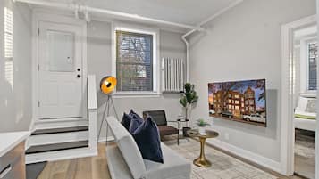 Classic Apartment, 1 Queen Bed | Living area | 55-inch TV with digital channels, streaming services