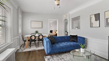 Deluxe Apartment, 2 Bedrooms | Living area | 55-inch TV with digital channels, streaming services