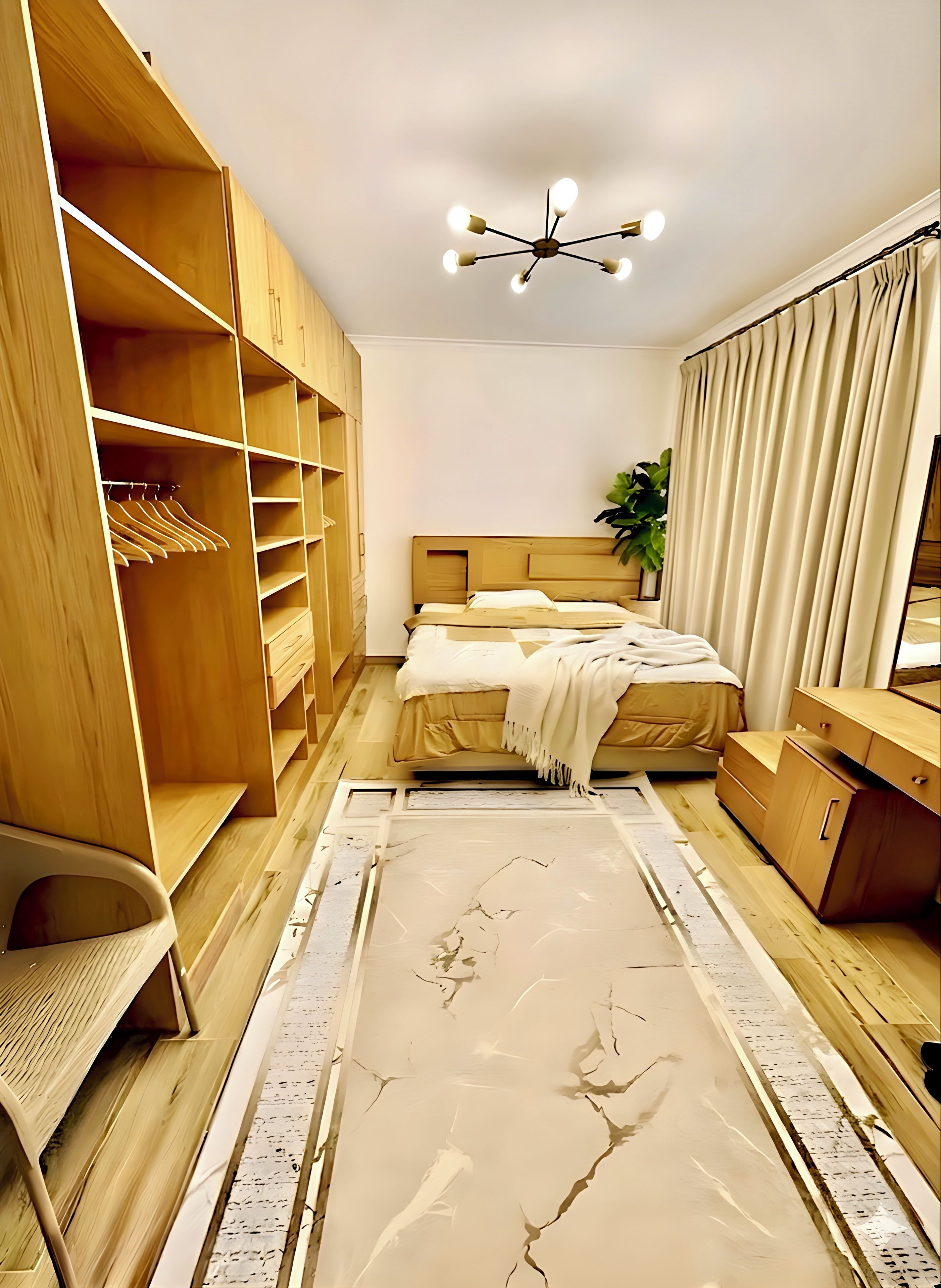 A bedroom with a bed, wooden wardrobe, and a ceiling light fixture.