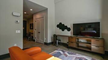 Deluxe Studio (Corner Studio) | Living area | 55-inch Smart TV with cable channels