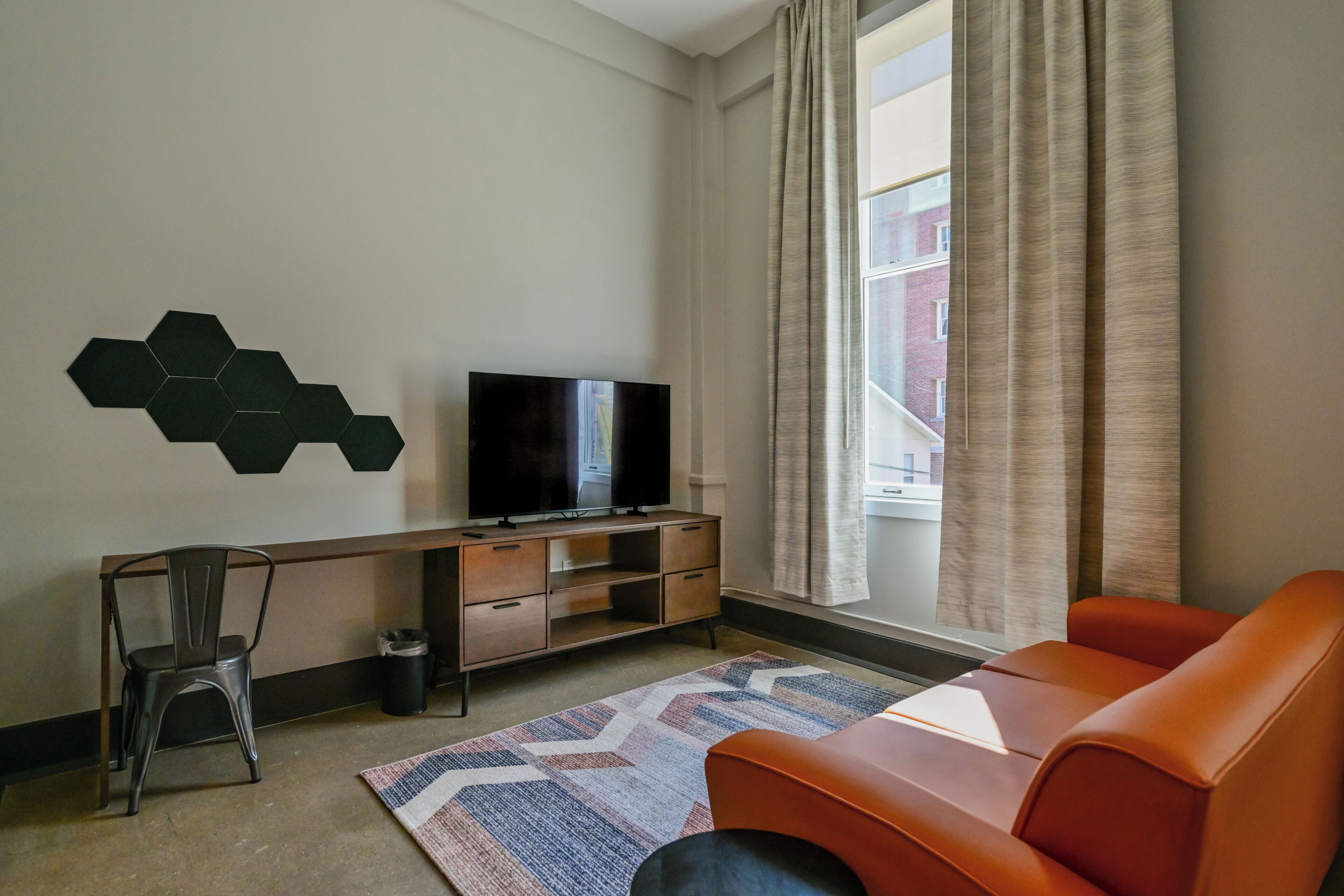 Deluxe Studio (Corner Studio) | Living area | 55-inch Smart TV with cable channels