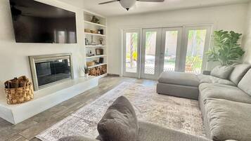 Smart TV, fireplace, books