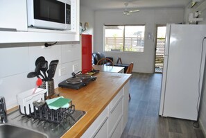 Fridge, microwave, stovetop, cookware/dishes/utensils