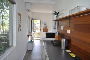 Fridge, microwave, stovetop, cookware/dishes/utensils