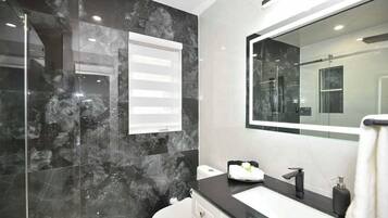 Shower, jetted tub, towels, soap