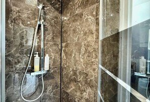 Shower, hair dryer, towels, soap