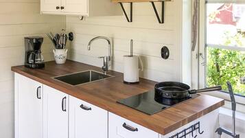 Fridge, stovetop, coffee/tea maker, cookware/dishes/utensils