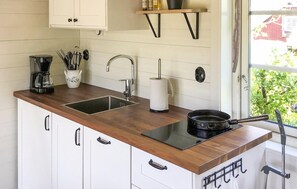 Fridge, stovetop, coffee/tea maker, cookware/dishes/utensils
