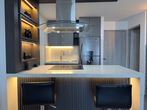 Fridge, microwave, stovetop, coffee/tea maker