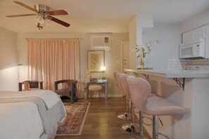 Desk, iron/ironing board, travel crib, bed sheets