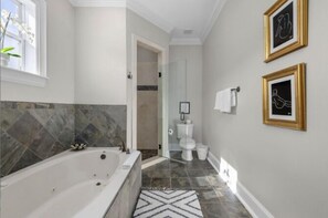 Shower, jetted bath, towels