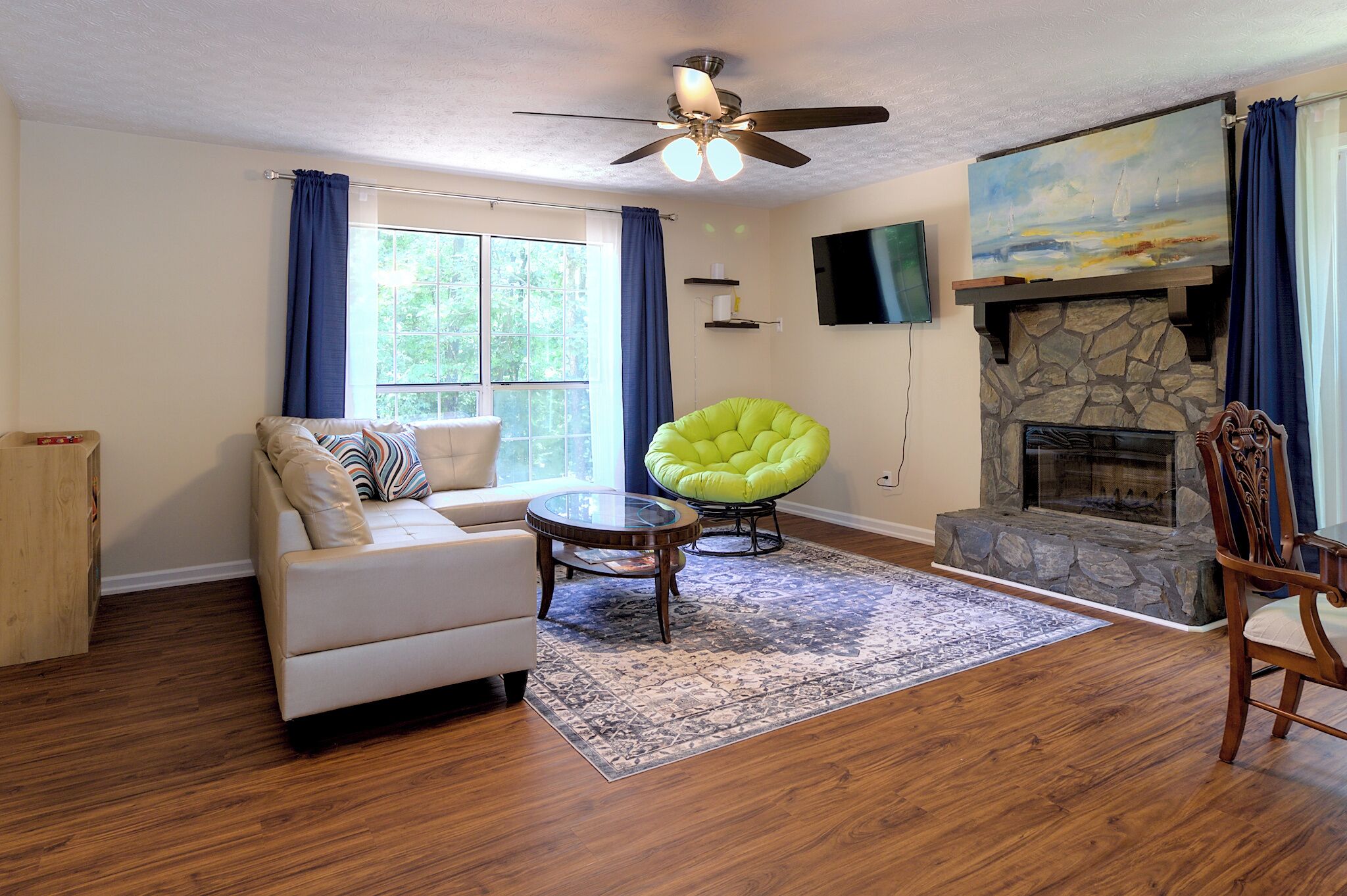 [LIVING ROOM] Plenty of natural light, opens to dining area, kitchen and patio.