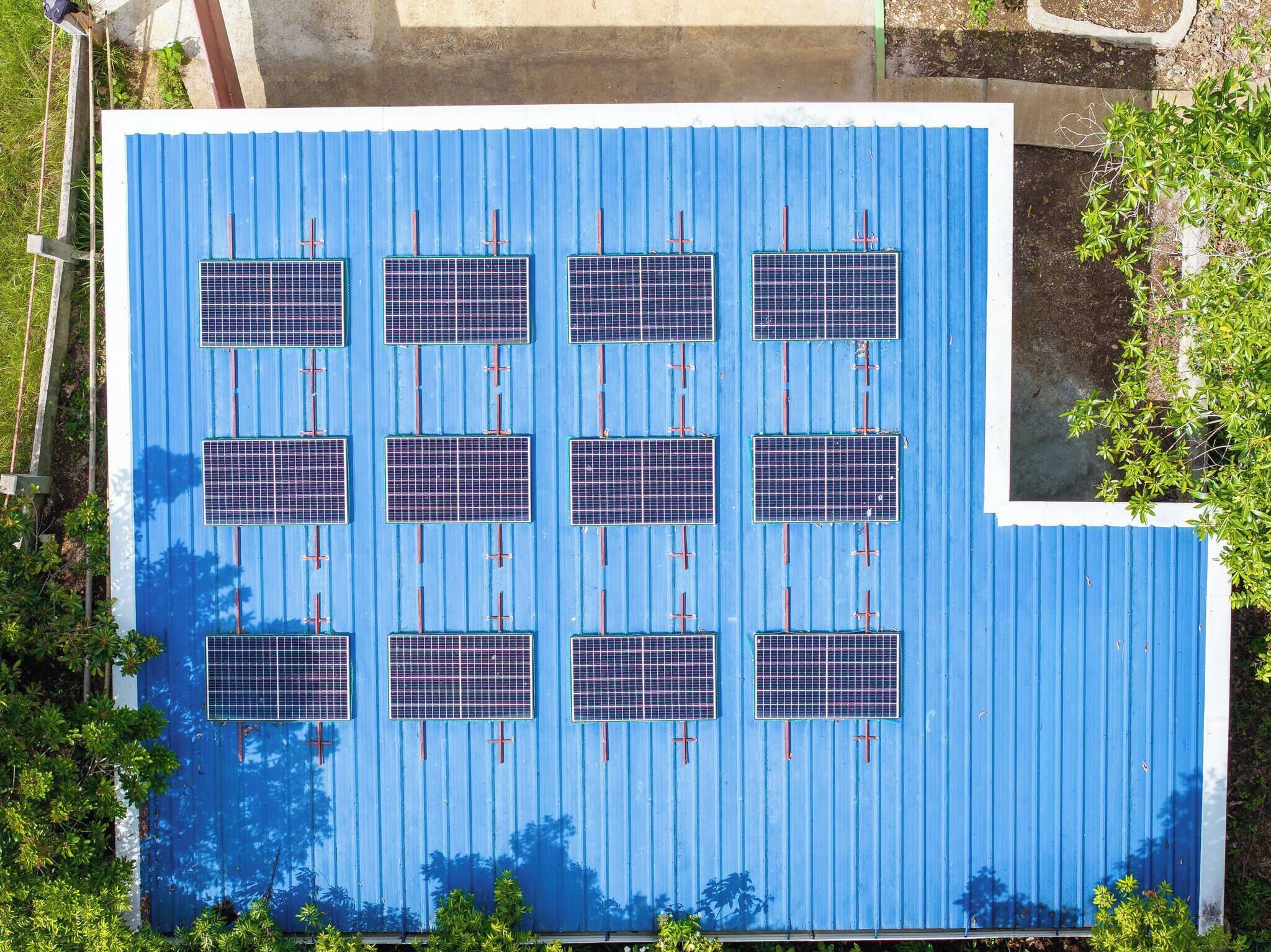 A rooftop with solar panels arranged in a grid pattern.