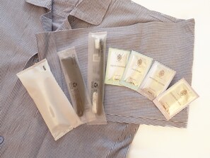 A striped fabric surface with several skincare product packages. - Toyoko Inn Tokyo Minowa eki (Tokyo)