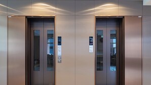 A pair of elevator doors with a digital display panel and a floor indicator. - Toyoko Inn Tokyo Minowa eki (Tokyo)