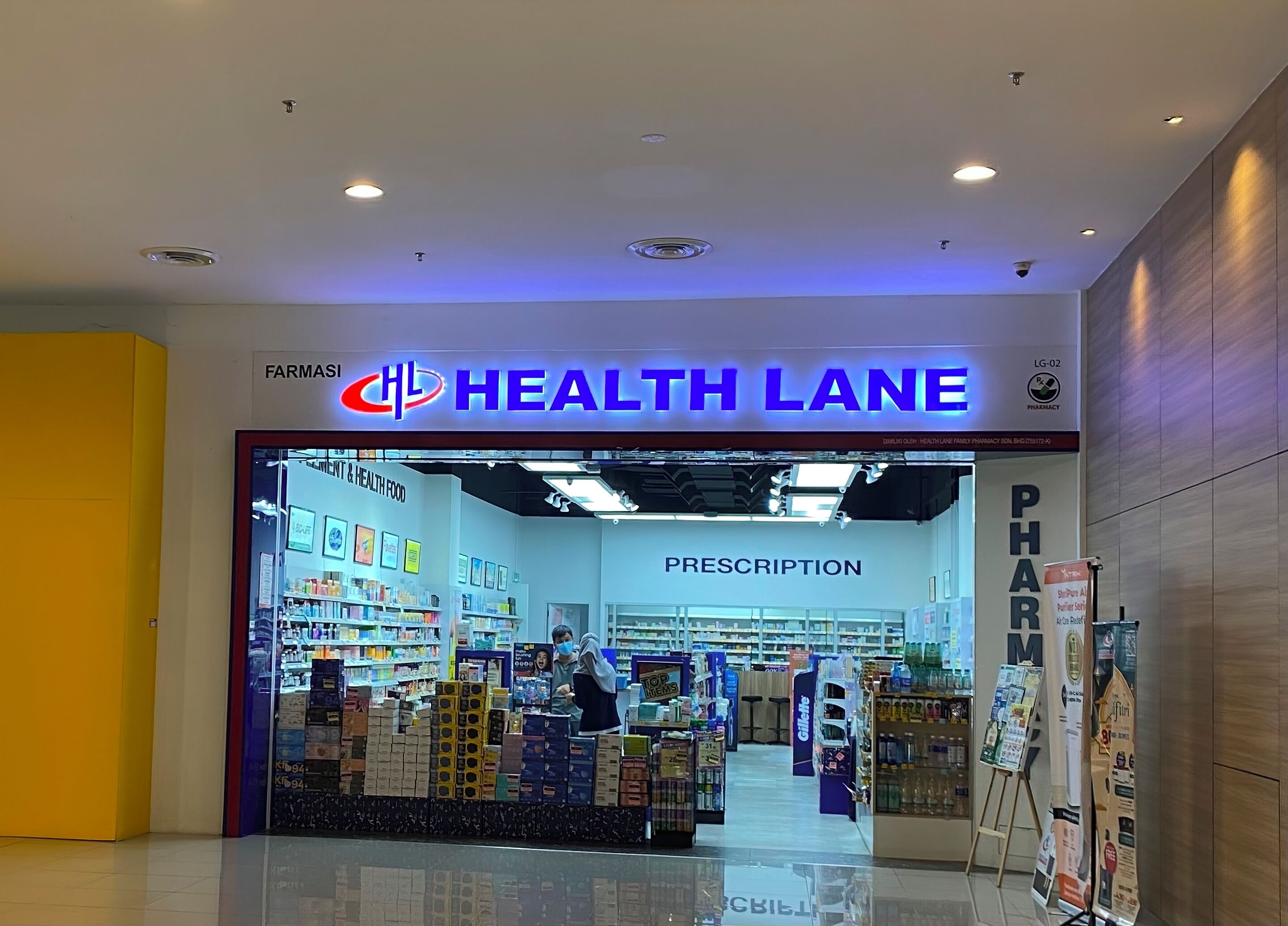 A pharmacy named 'Health Lane' with a clear sign indicating a prescription section.