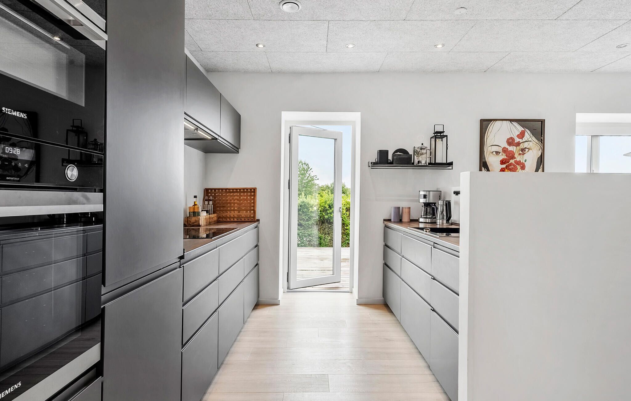 Fridge, stovetop, dishwasher, coffee/tea maker