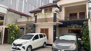 A two-story building with a sign for 'Malioeoro Suites'. - Attanaya Malioboro Suites (Yogyakarta)