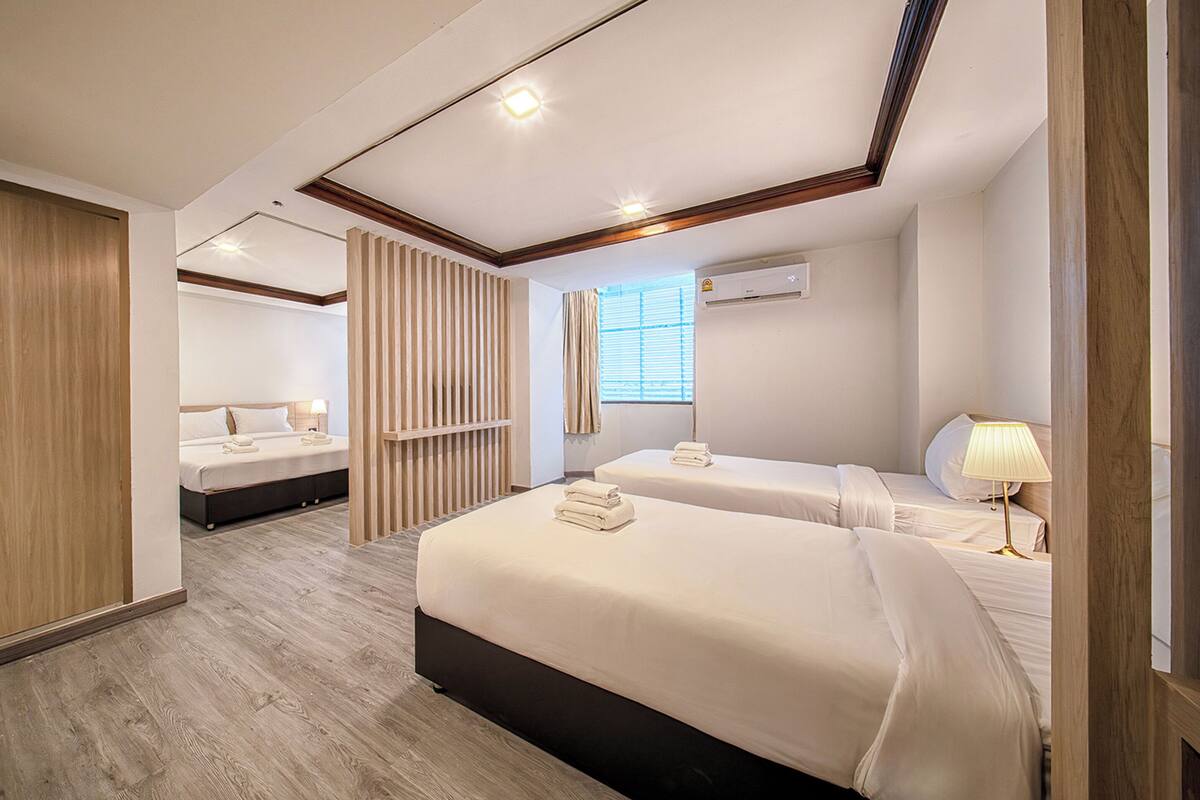 Family Suite Room | Blackout curtains, free WiFi, bed sheets