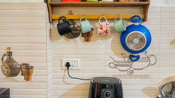 Microwave, coffee/tea maker, electric kettle, cookware/dishes/utensils