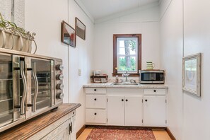 Fridge, microwave, coffee/tea maker, cookware/dishes/utensils