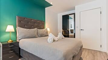 1 bedroom, desk, iron/ironing board, travel crib