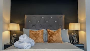 1 bedroom, desk, iron/ironing board, travel crib