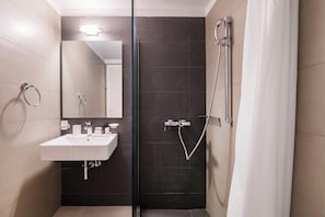 Shower, free toiletries, slippers, towels
