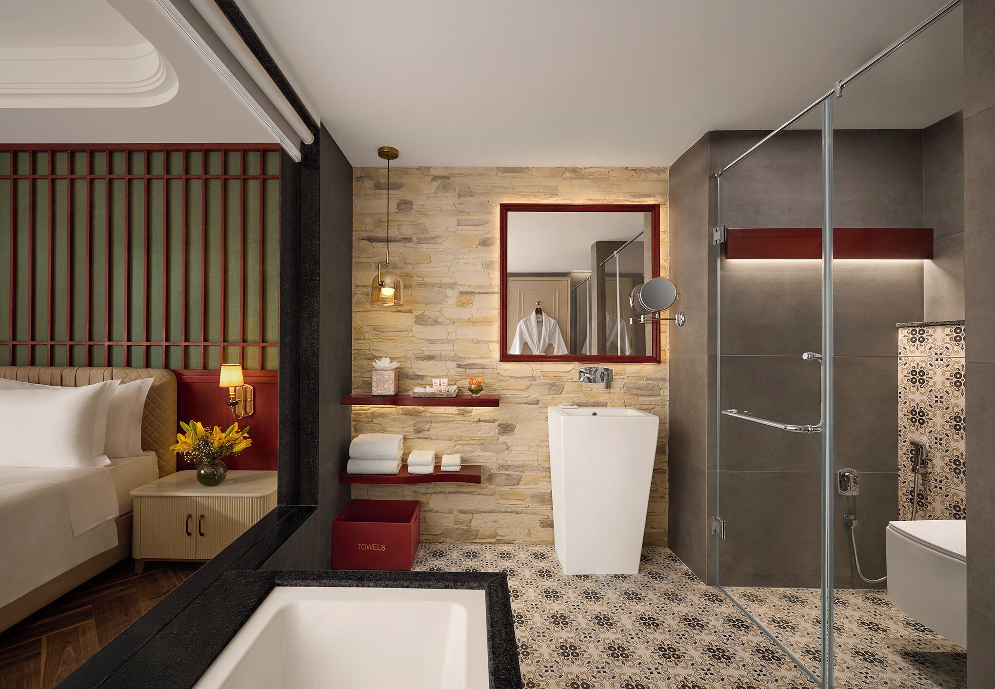 A modern bathroom with a glass shower enclosure, a white sink, and a large mirror.