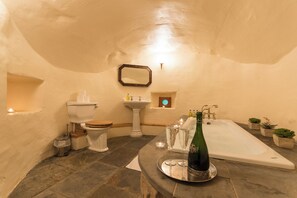 Apartment, Garden View | Bathroom | Bathtub, hair dryer, towels, soap