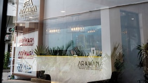 A modern hotel facade with a prominent logo and signage for 'Arawana Hotels and Residences'. - Arawana Express North Pattaya (Pattaya)