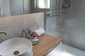 Shower, hair dryer, towels, toilet paper