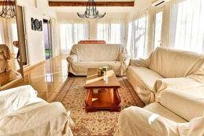 Smart TV, fireplace, table football, books