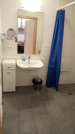 Hair dryer, towels, soap, toilet paper
