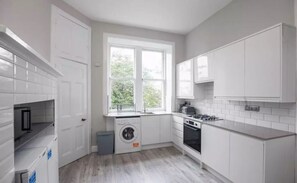 Apartment | Private kitchen | Fridge, oven, stovetop, electric kettle - Spacious 3-Bedroom Flat in Charming Bruntsfield (Edinburgh)