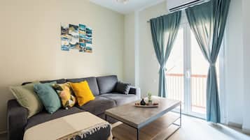 Apartment, 1 Bedroom, Kitchen, City View | Living room | 53-inch Smart TV with digital channels, streaming services