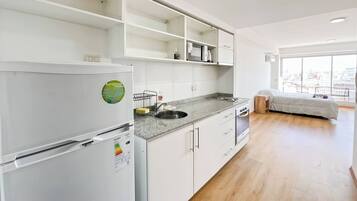 Fridge, microwave, stovetop, coffee/tea maker