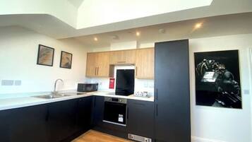 Fridge, oven, cookware/dishes/utensils