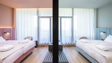 Habitación cuádruple Deluxe | Sábanas de algodón egipcio y ropa de cama de alta calidad