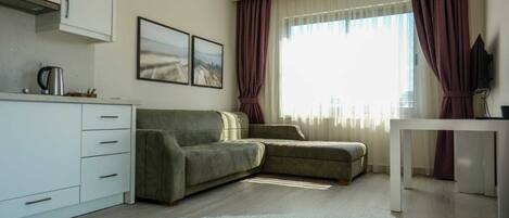 Apartamento, 1 quarto, sacada, vista para o mar | Cozinha privada | Geladeira, cooktop, cadeirão de bebê, freezer