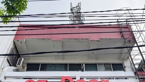 A building with a sign reading "ez Door" and multiple air conditioning units installed on the exterior. - Ez Door (Yogyakarta)