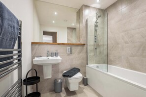 Shower, hair dryer, towels, shampoo