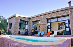 2 outdoor pools, open 9:00 AM to 7:00 PM, pool umbrellas, pool loungers