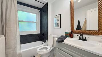 Shower, hair dryer, towels, shampoo