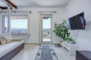 Standard Apartment, Multiple Bedrooms (Apartment Smode With Lovely View) | Living area | 21-inch TV with digital channels