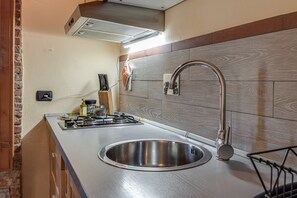 Fridge, stovetop, coffee/tea maker, cookware/dishes/utensils